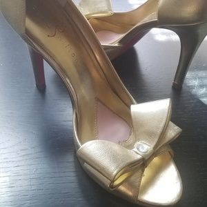 Paris Hilton gold pumps